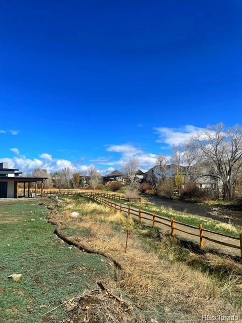 306 Southside Loop Salida, CO 81201 - Photo 20 of 37 a view of a lake with houses in the background