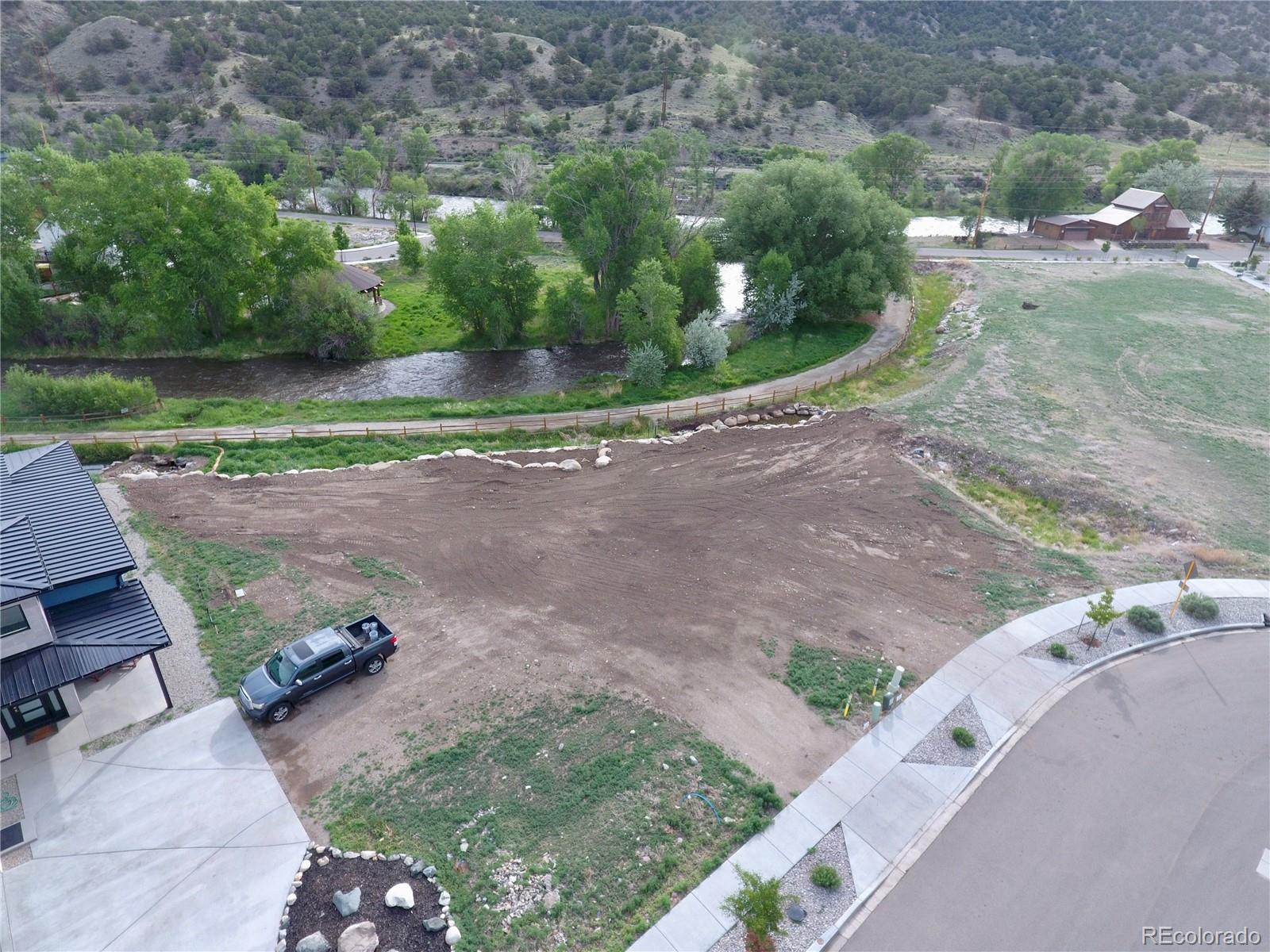 306 Southside Loop Salida, CO 81201 - Photo 35 of 37 an aerial view of a house with a yard and greenery