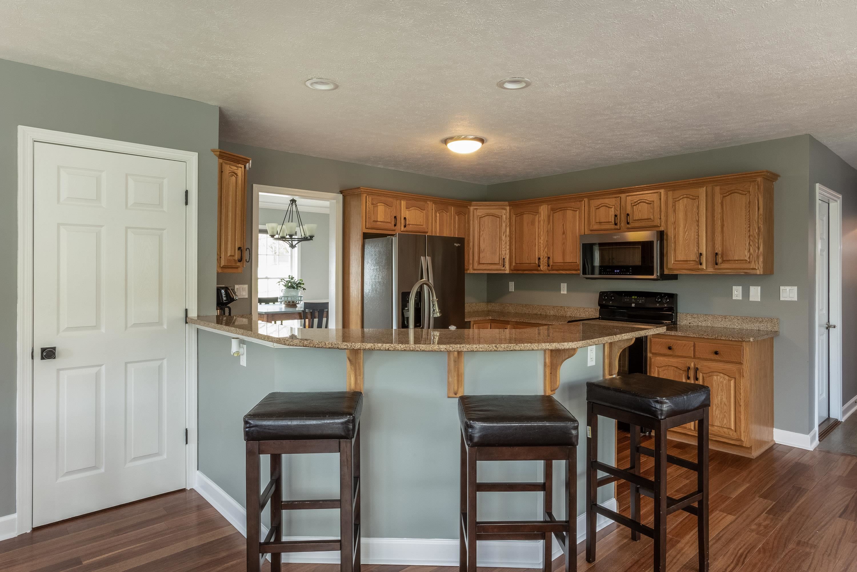 3850 Davis Road Penn Laird, VA 22846 - Photo 11 of 70 a kitchen with stainless steel appliances granite countertop a stove top oven a granite counter tops and a refrigerator