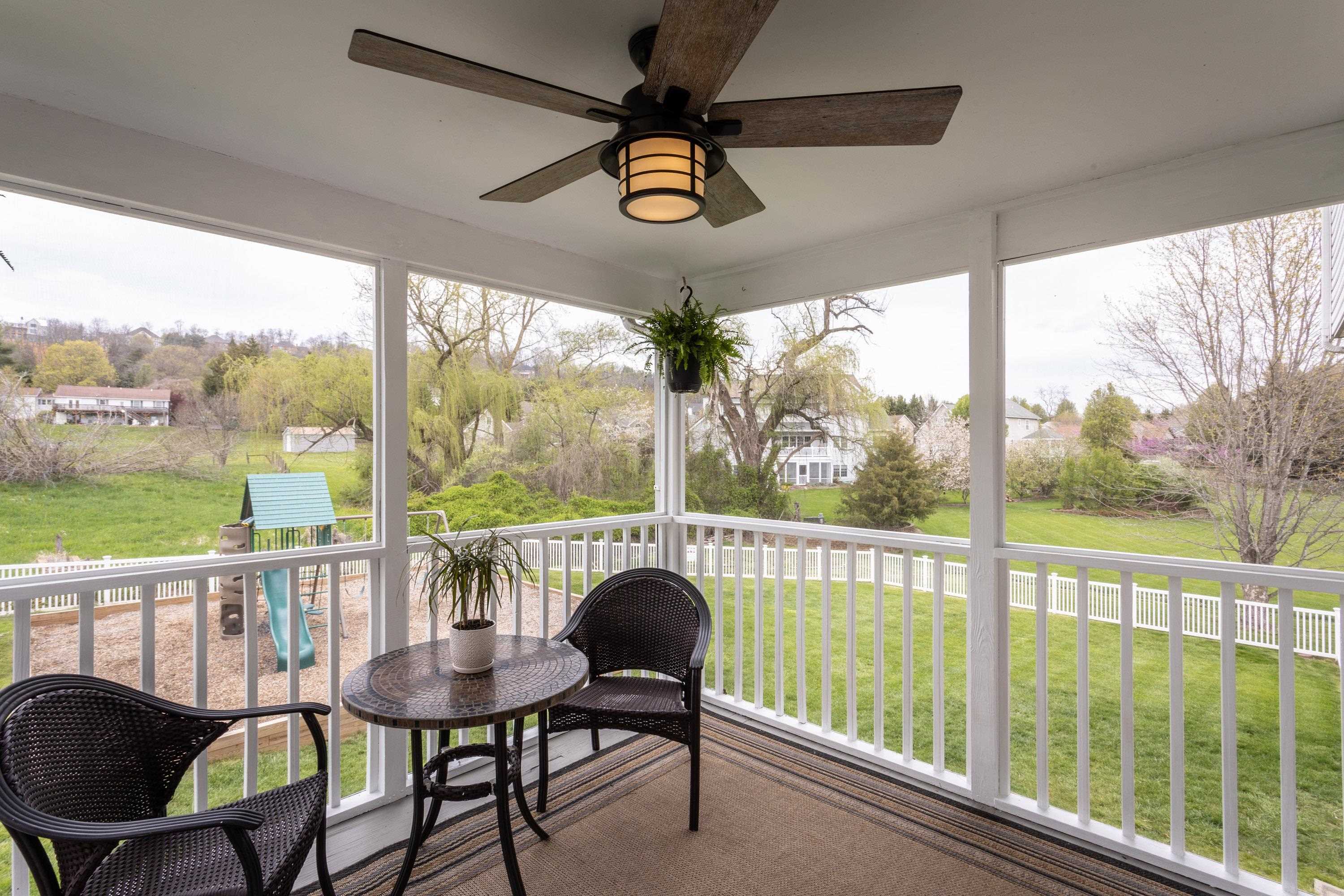 3850 Davis Road Penn Laird, VA 22846 - Photo 17 of 70 a view of a chairs and table in patio and yard in the back