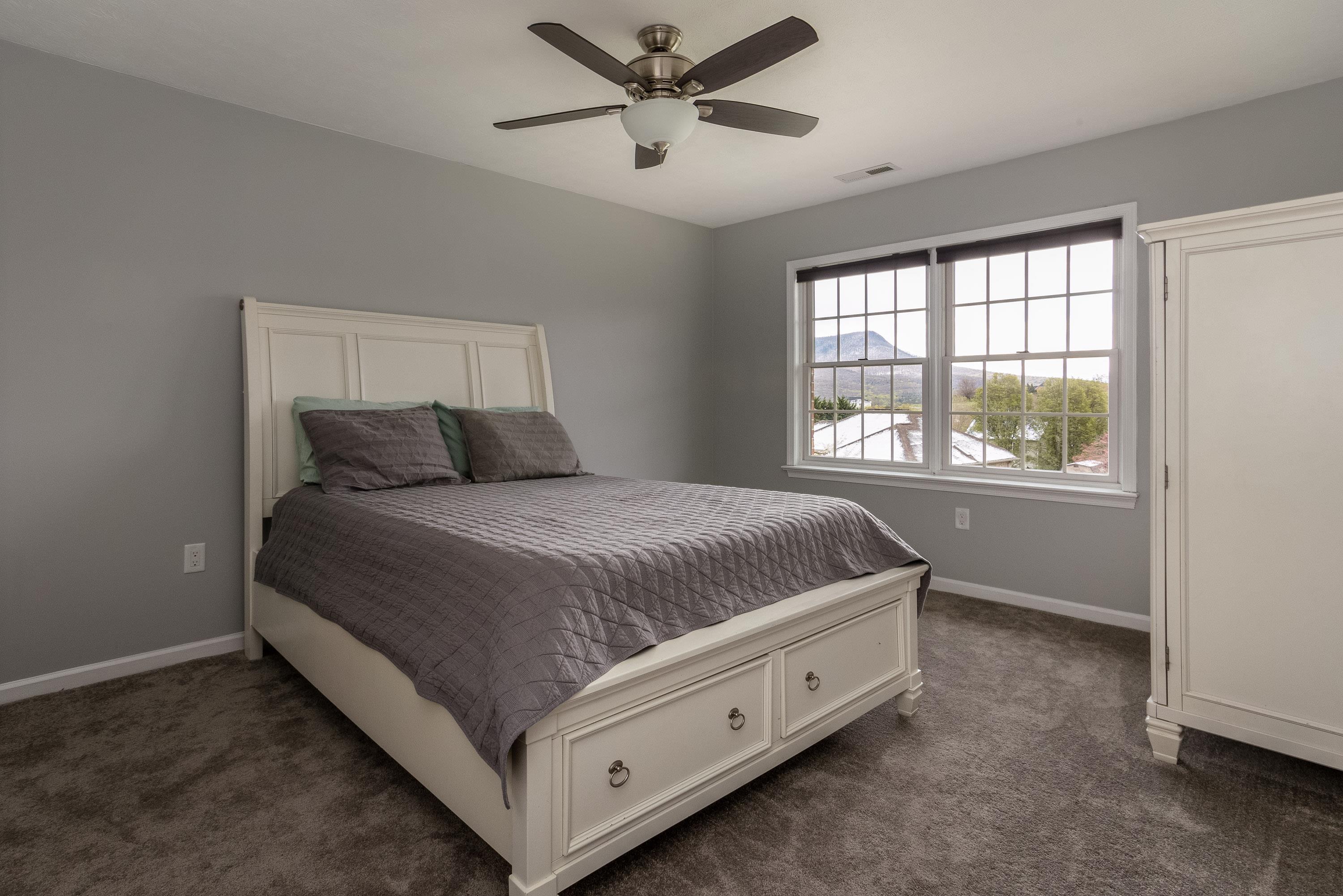 3850 Davis Road Penn Laird, VA 22846 - Photo 26 of 70 a spacious bedroom with a bed and window