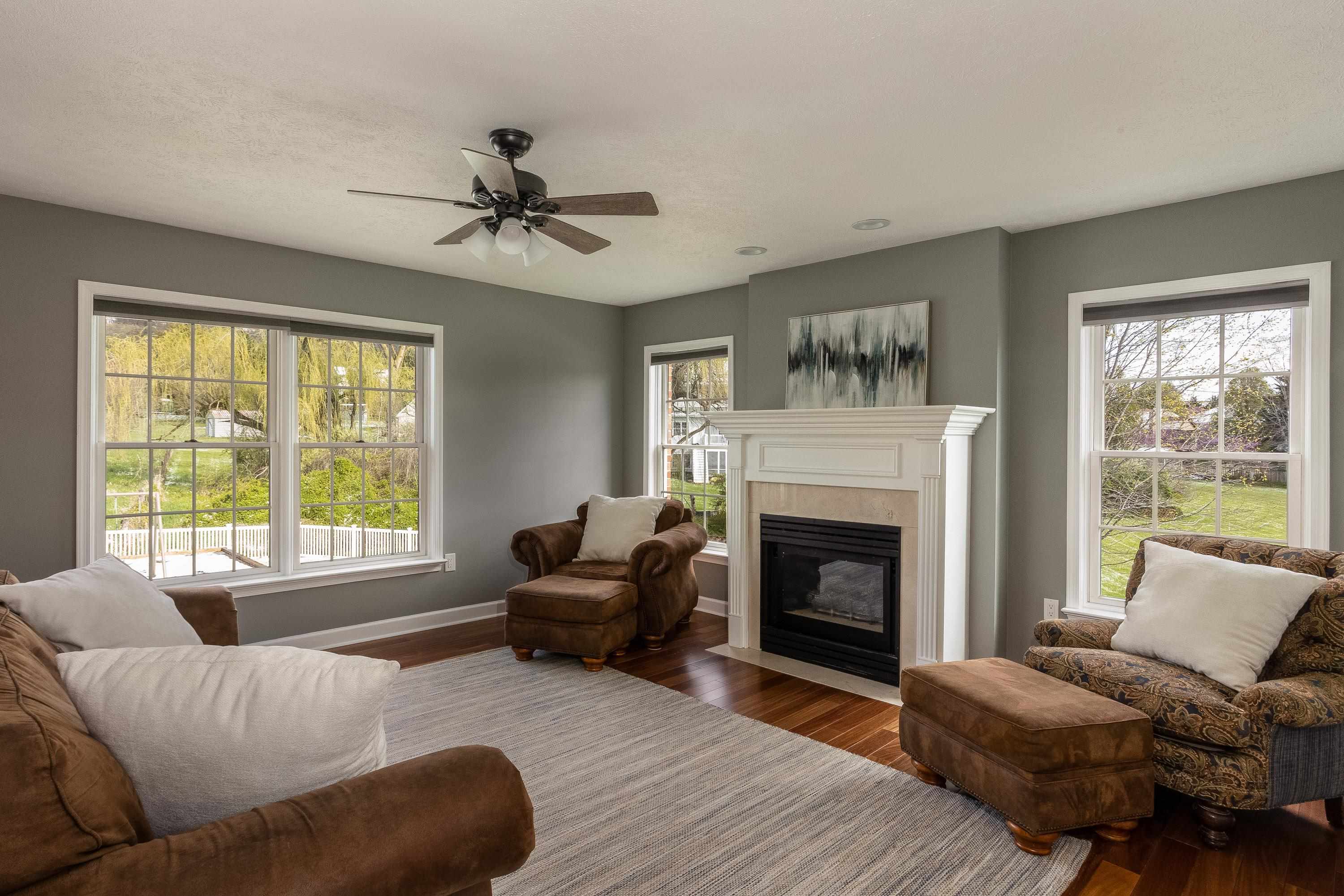 3850 Davis Road Penn Laird, VA 22846 - Photo 8 of 70 a living room with furniture a fireplace and a large window