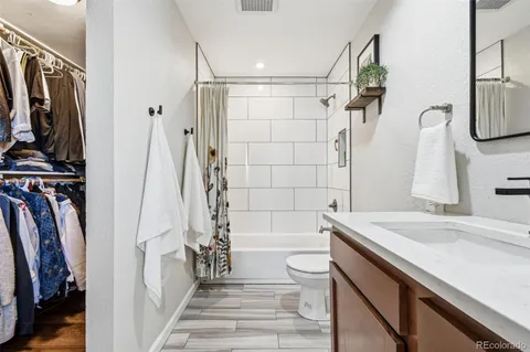 a bathroom with a sink a toilet and a bathtub