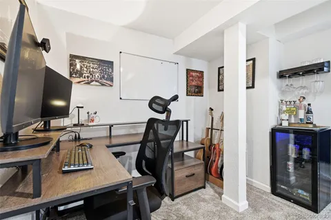 a view of a workspace with furniture