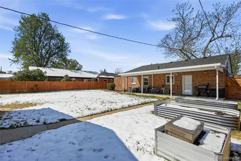 a view of a house with snow on the road