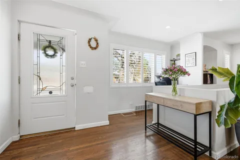 a view of kitchen and sink with wooden floor