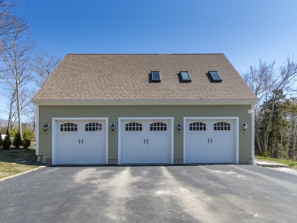 86 Spring Hill Loop Chamberlain, ME 04541 - Photo 32 of 35 Three bay garage