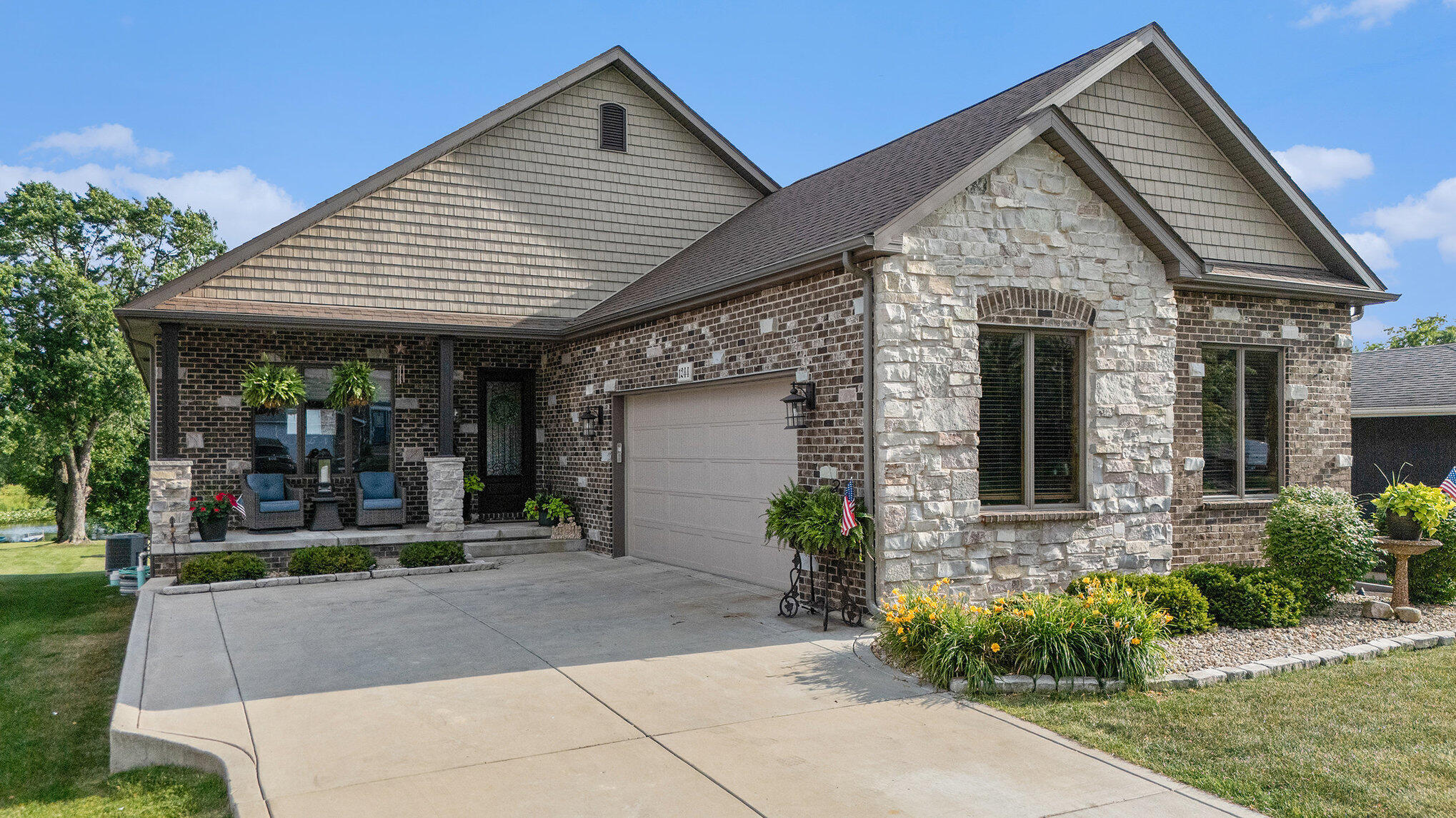 1244 Brandywine Road Crown Point, IN 46307 - Photo 1 of 42 a front view of a house with garden