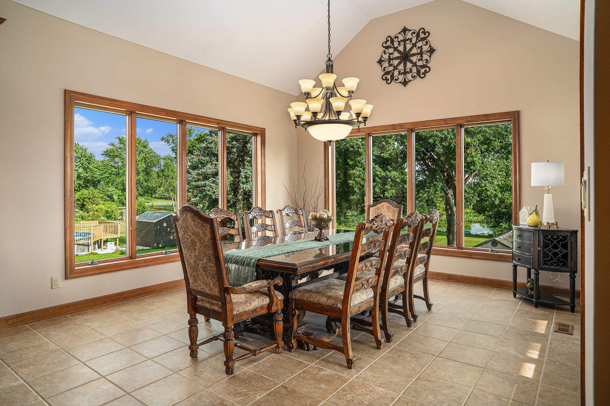 1244 Brandywine Road Crown Point, IN 46307 - Photo 14 of 42 a view of a dining room with furniture large windows and wooden floor