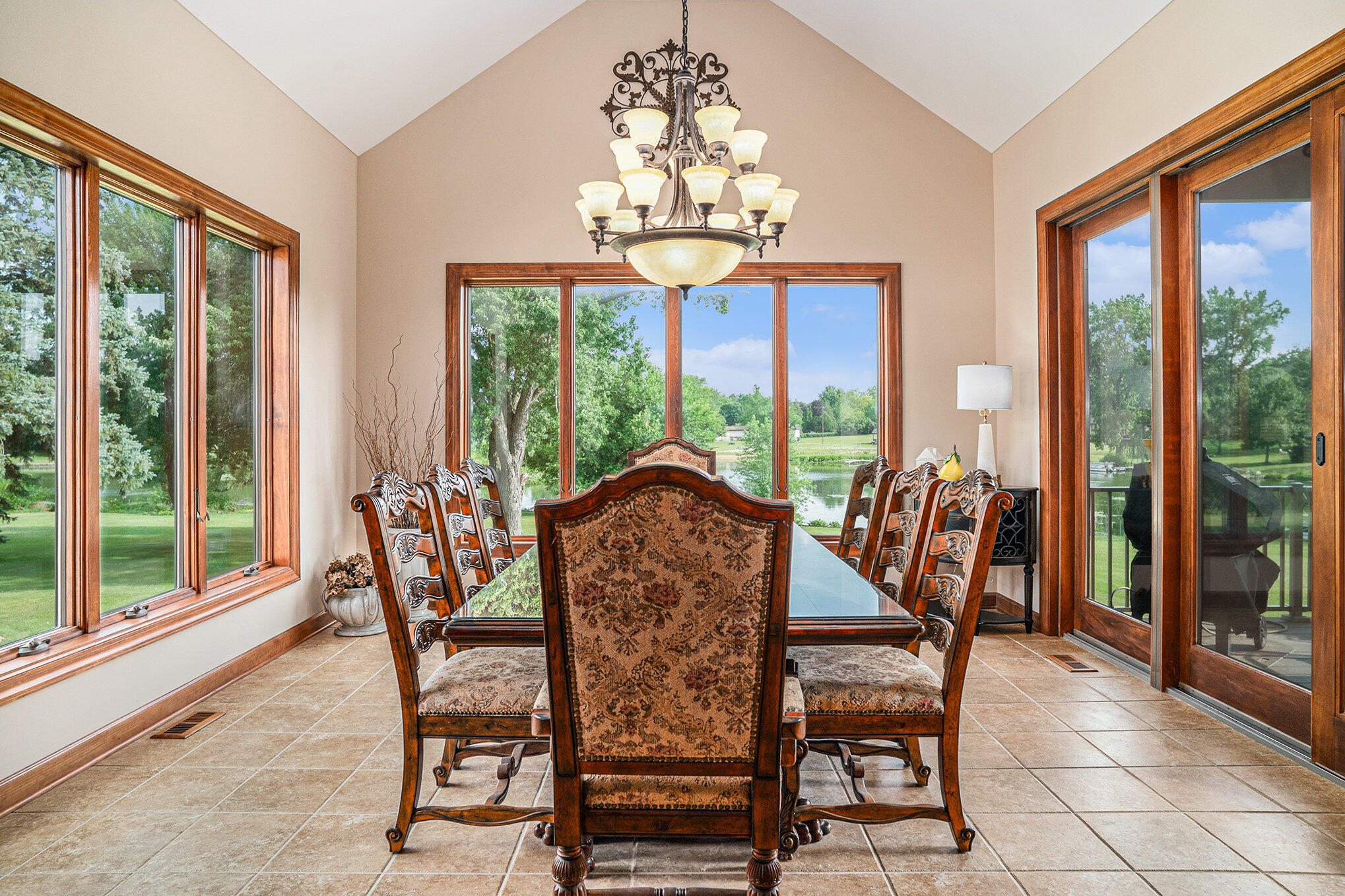 1244 Brandywine Road Crown Point, IN 46307 - Photo 15 of 42 a view of a dining room with furniture large windows and wooden floor