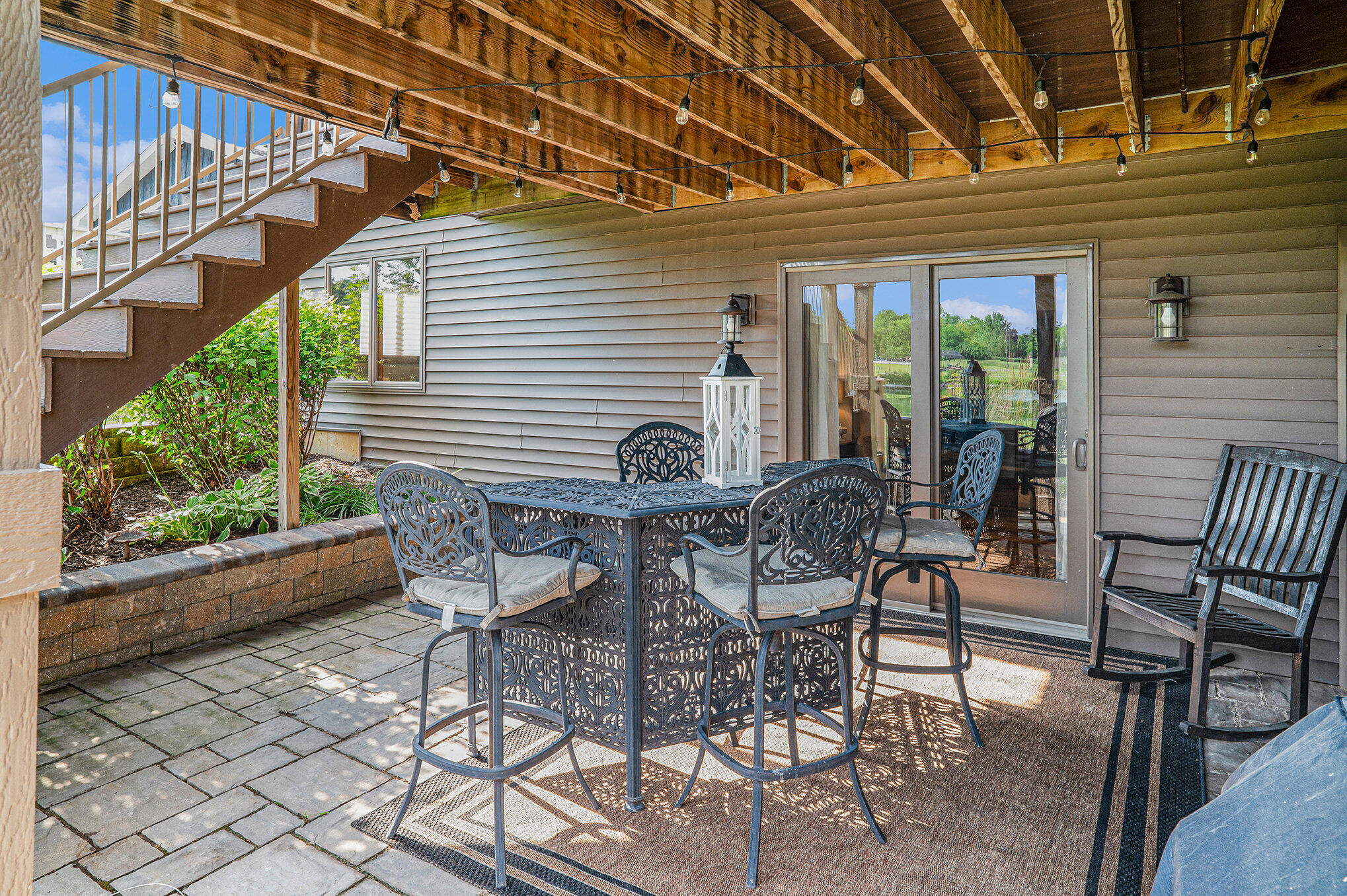1244 Brandywine Road Crown Point, IN 46307 - Photo 33 of 42 a view of a patio with a table and chairs and potted plants
