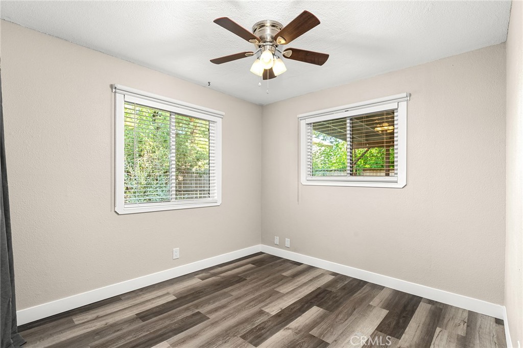 1131 Stewart Avenue Chico, CA 95926 - Photo 18 of 50 a view of an empty room with window and wooden floor