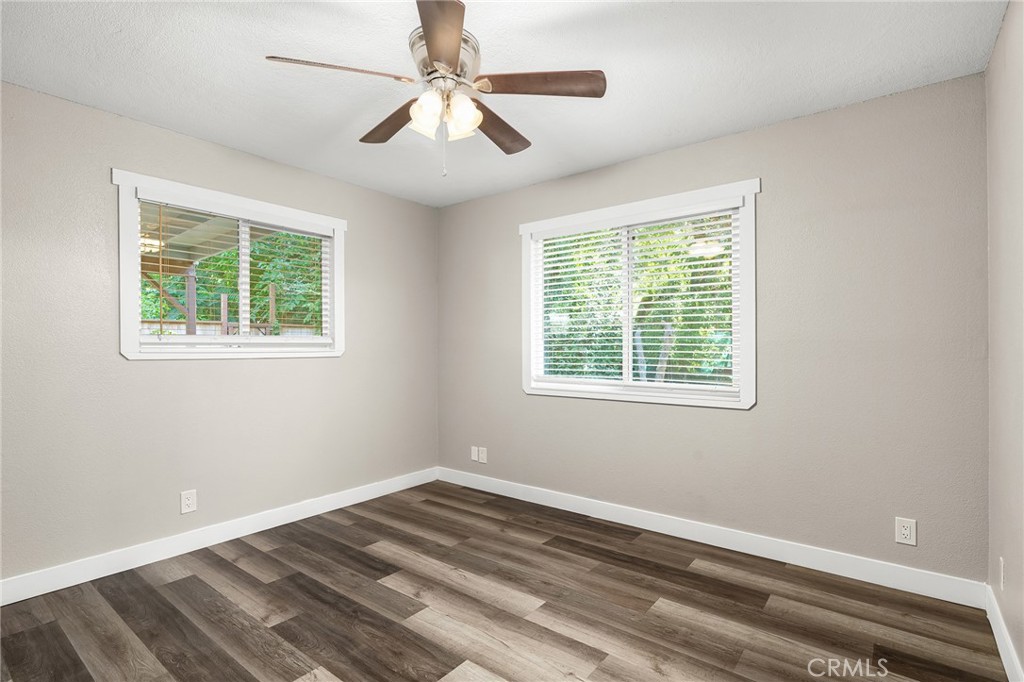1131 Stewart Avenue Chico, CA 95926 - Photo 20 of 50 a view of an empty room with wooden floor and a window