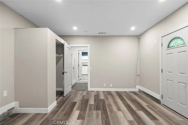 a view of hallway with wooden floor