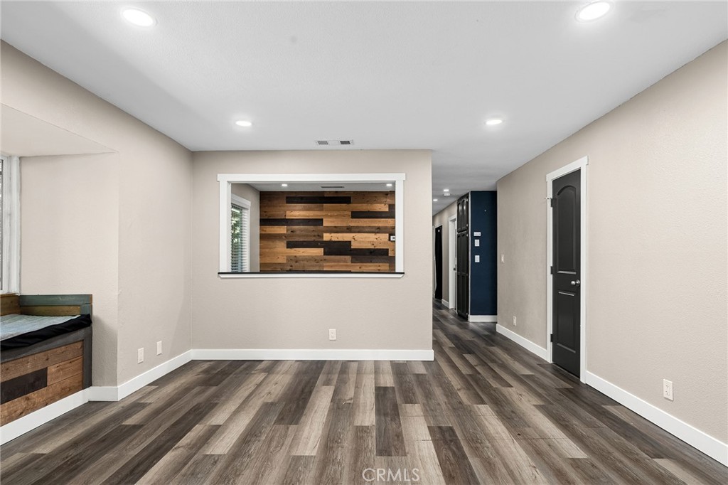 1131 Stewart Avenue Chico, CA 95926 - Photo 3 of 50 a view of an empty room with wooden floor