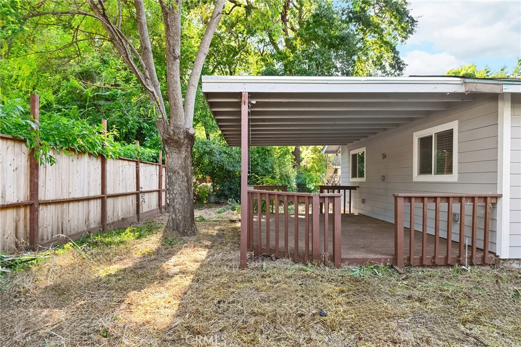 1131 Stewart Avenue Chico, CA 95926 - Photo 36 of 50 a view of a house with a small yard and wooden fence