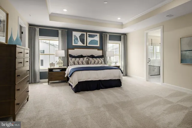 a bedroom with a bed and a night stand