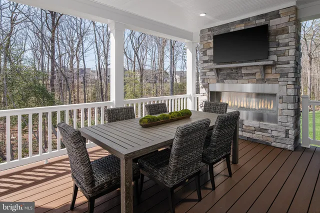 a view of a patio with a table and chairs