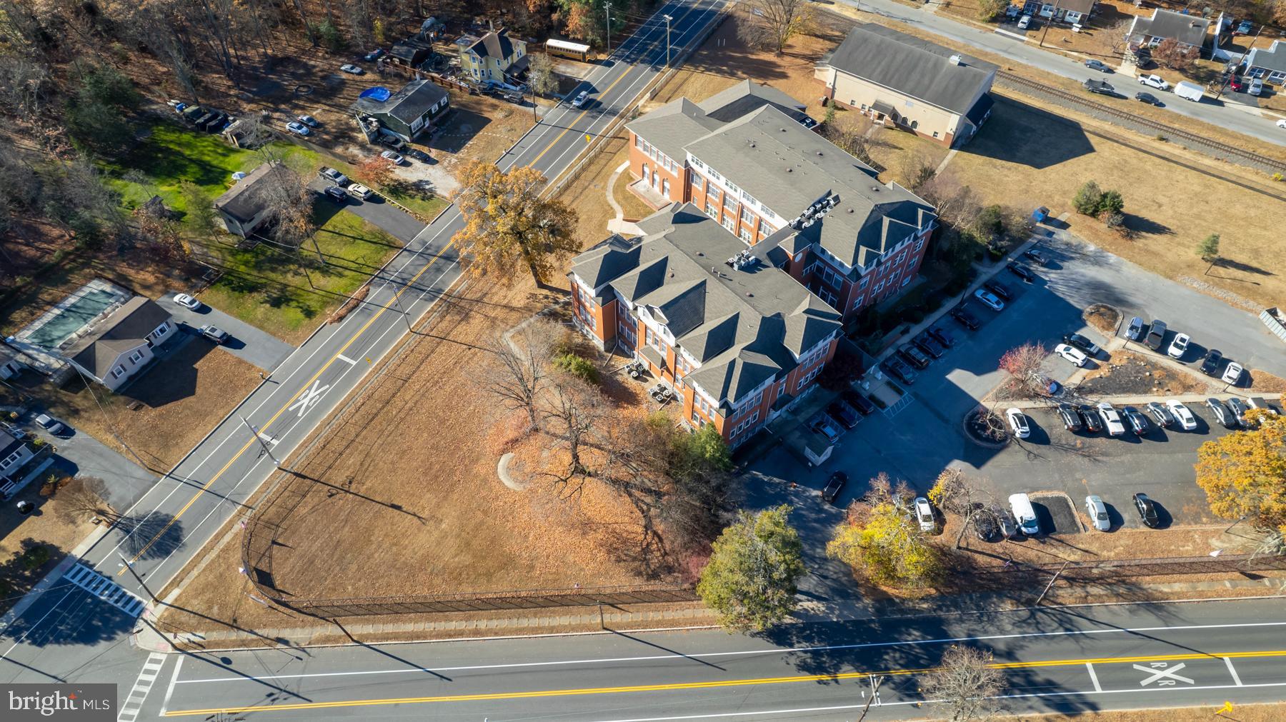 100 Aura Road, Unit 110 Clayton, NJ 08312 - Photo 16 of 34 an aerial view of a house with a yard and garage