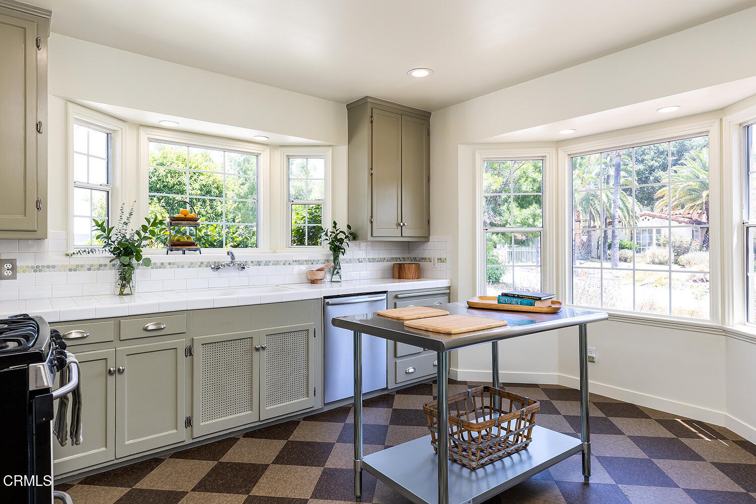 3255 Castera Avenue Glendale, CA 91208 - Photo 18 of 40 a kitchen with a table chairs sink and cabinets
