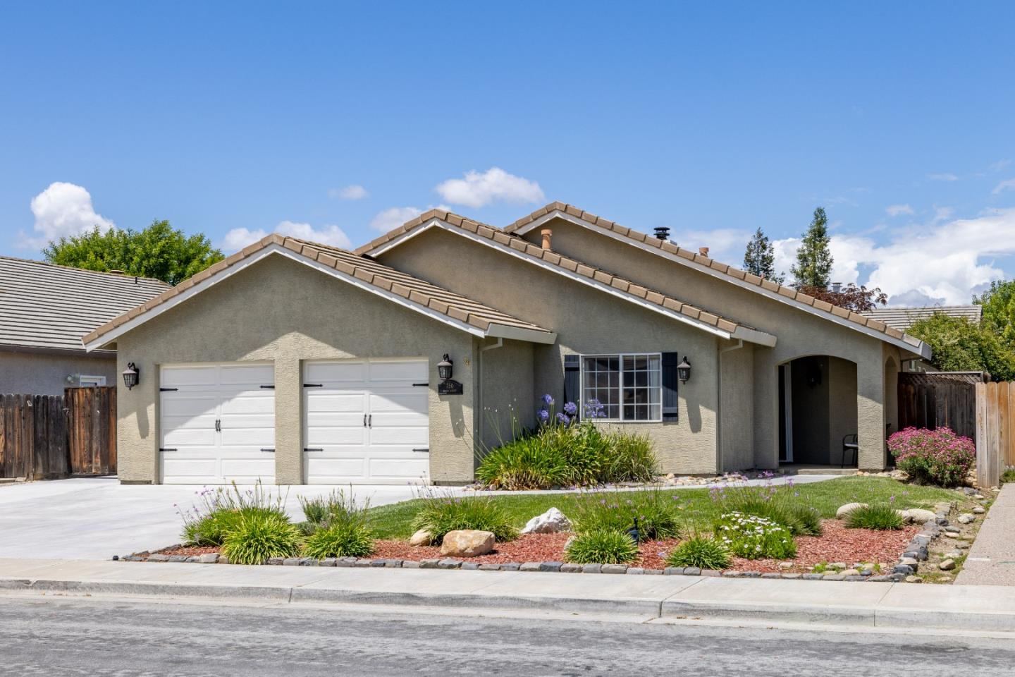 750 Ruger Court Hollister, CA 95023 - Photo 1 of 15 a front view of a house with a yard