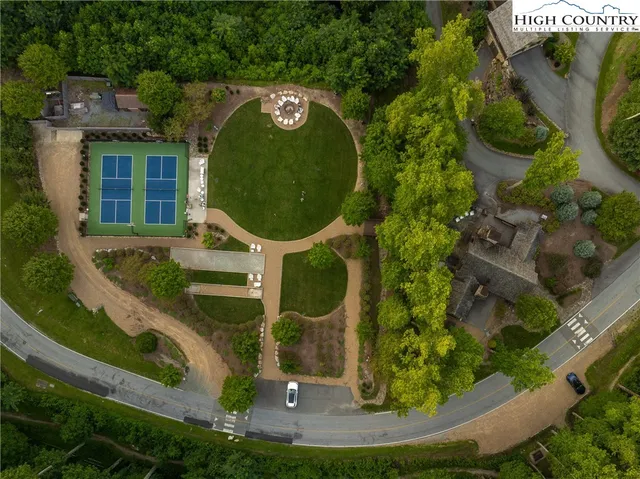 a view of a swimming pool with a yard
