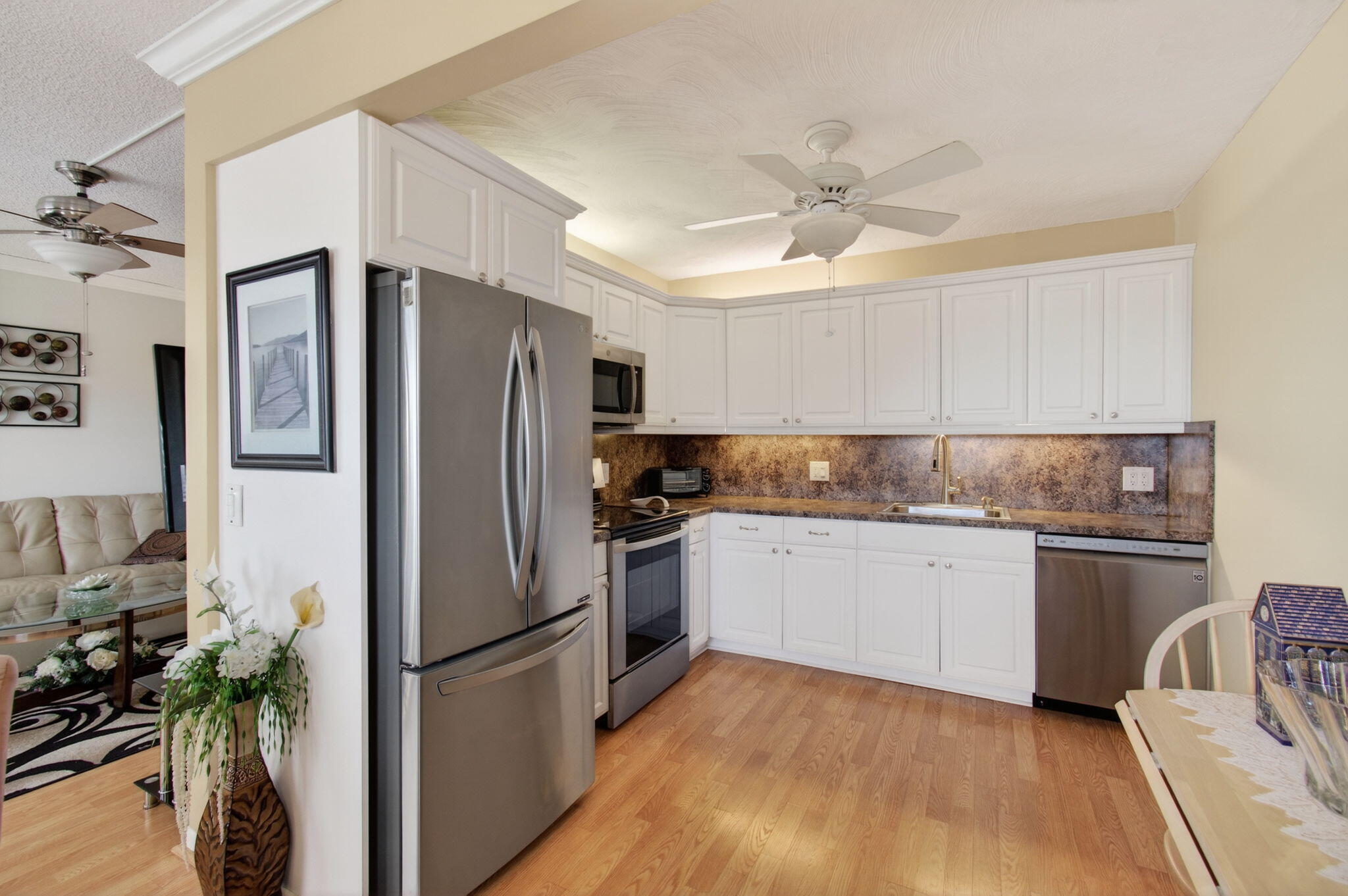 4082 Wolverton East Boca Raton, FL 33434 - Photo 13 of 93 a kitchen with granite countertop a refrigerator stove top oven and sink