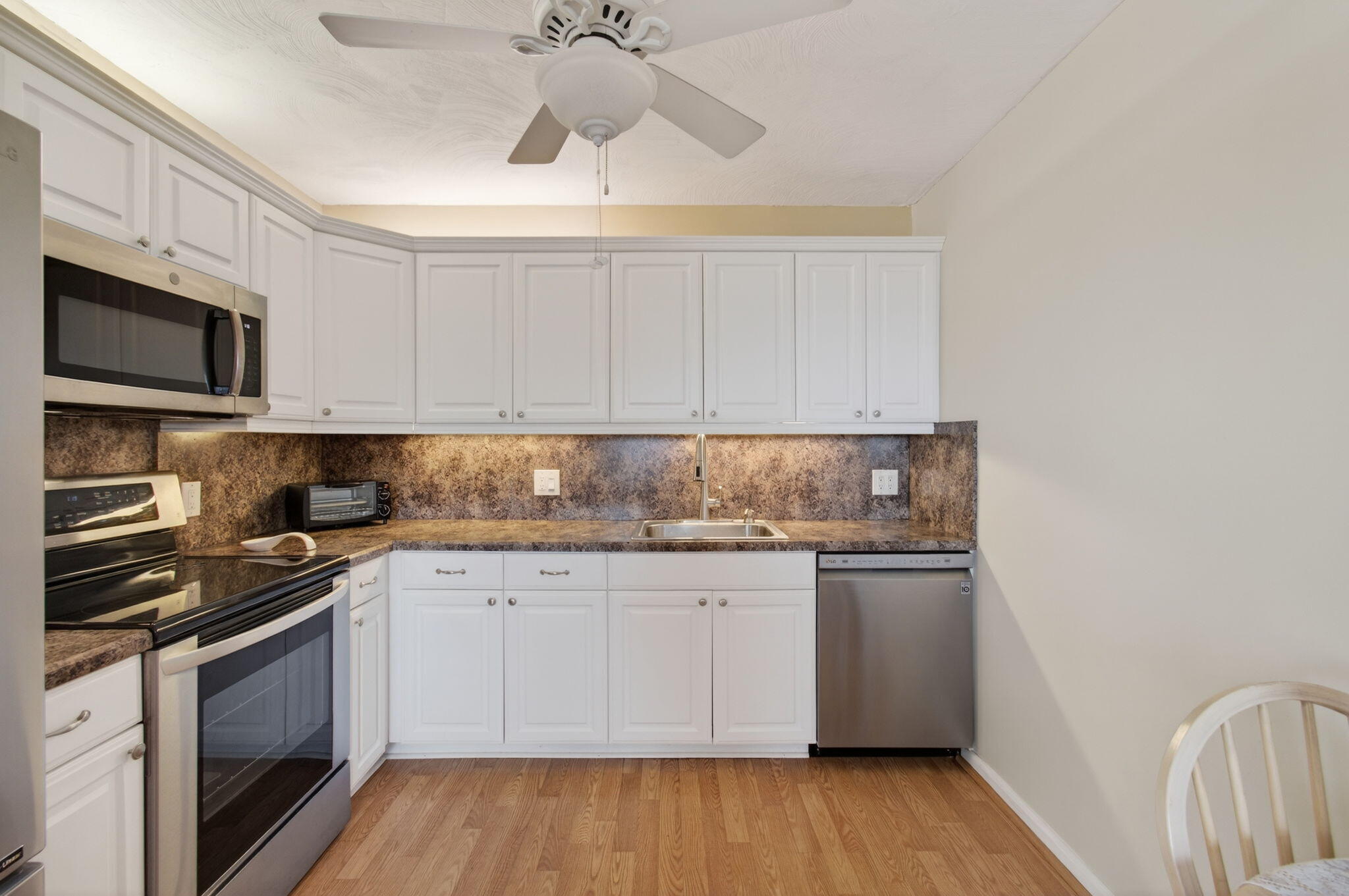 4082 Wolverton East Boca Raton, FL 33434 - Photo 15 of 93 a kitchen with granite countertop a stove and a sink