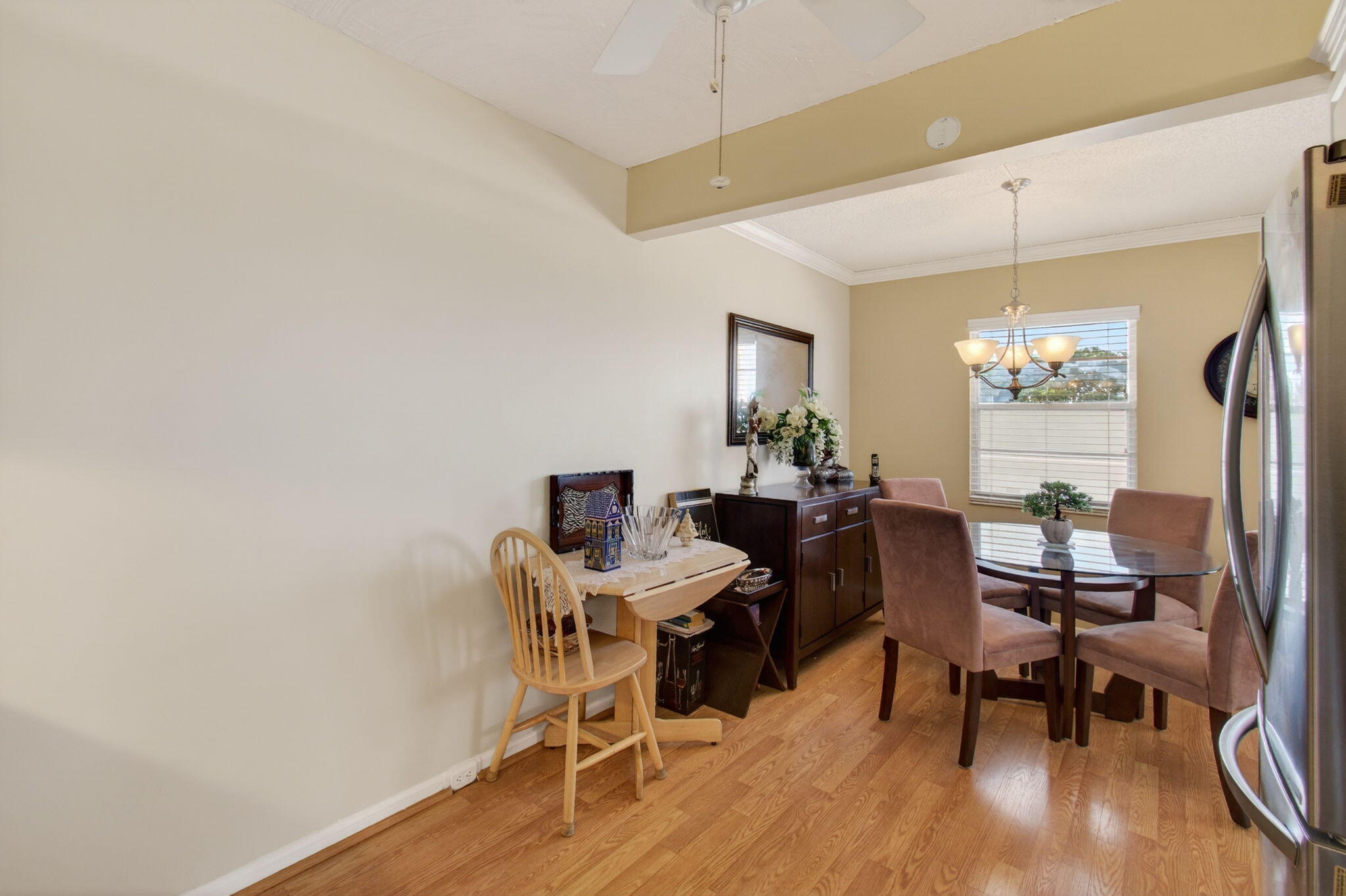 4082 Wolverton East Boca Raton, FL 33434 - Photo 17 of 93 a view of a dining room with furniture and wooden floor
