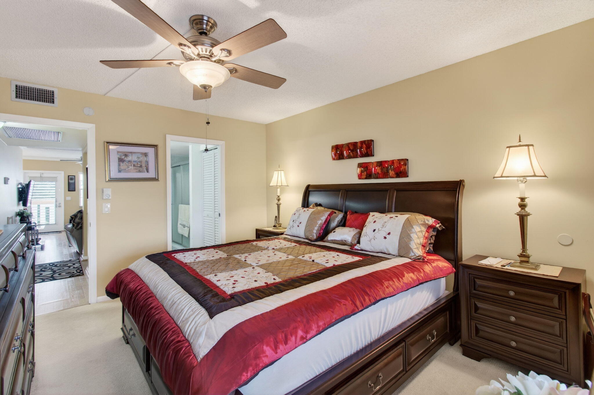 4082 Wolverton East Boca Raton, FL 33434 - Photo 22 of 93 a bedroom with a bed and a chandelier