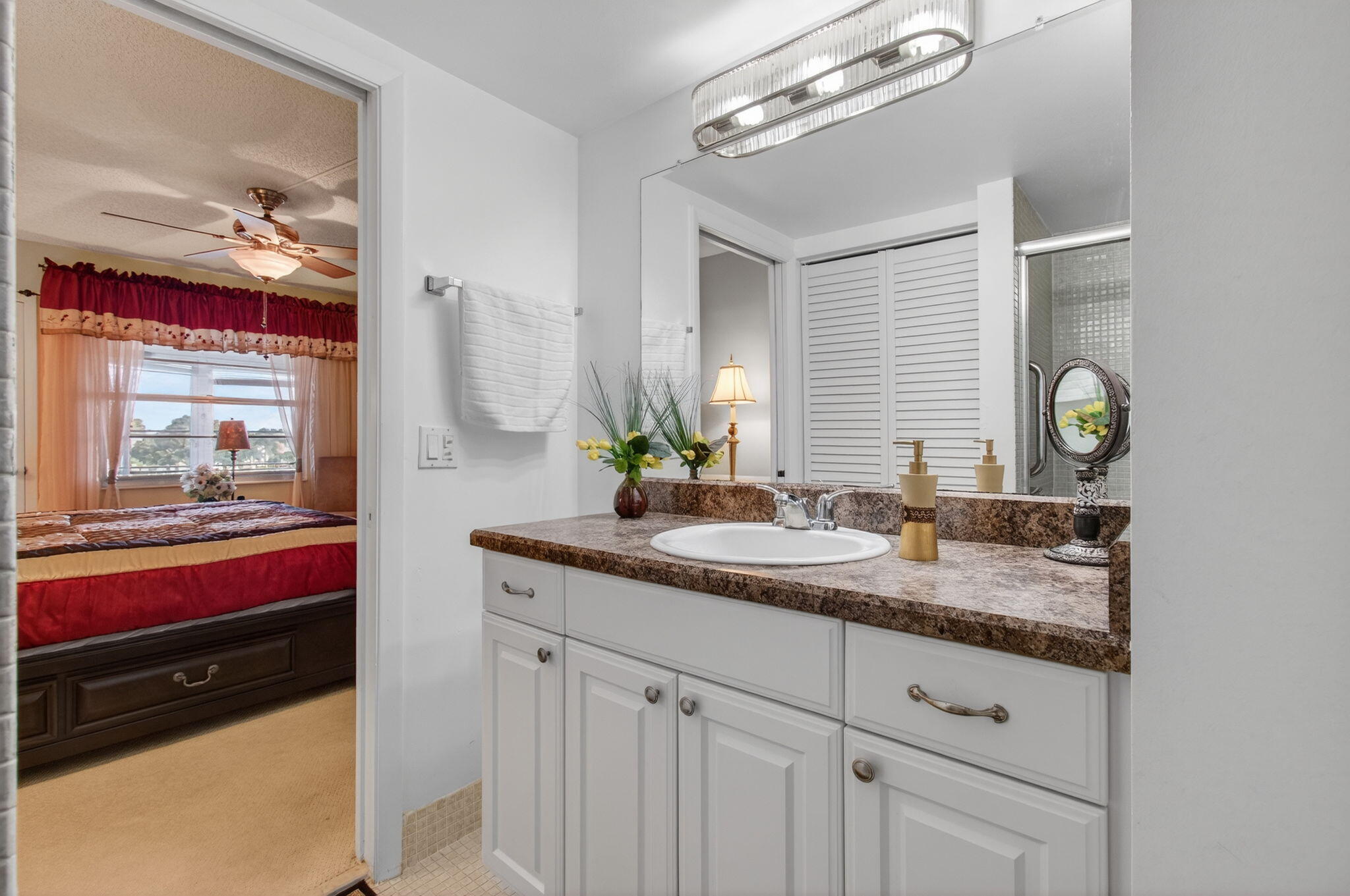 4082 Wolverton East Boca Raton, FL 33434 - Photo 27 of 93 a bathroom with a granite countertop double vanity and a mirror