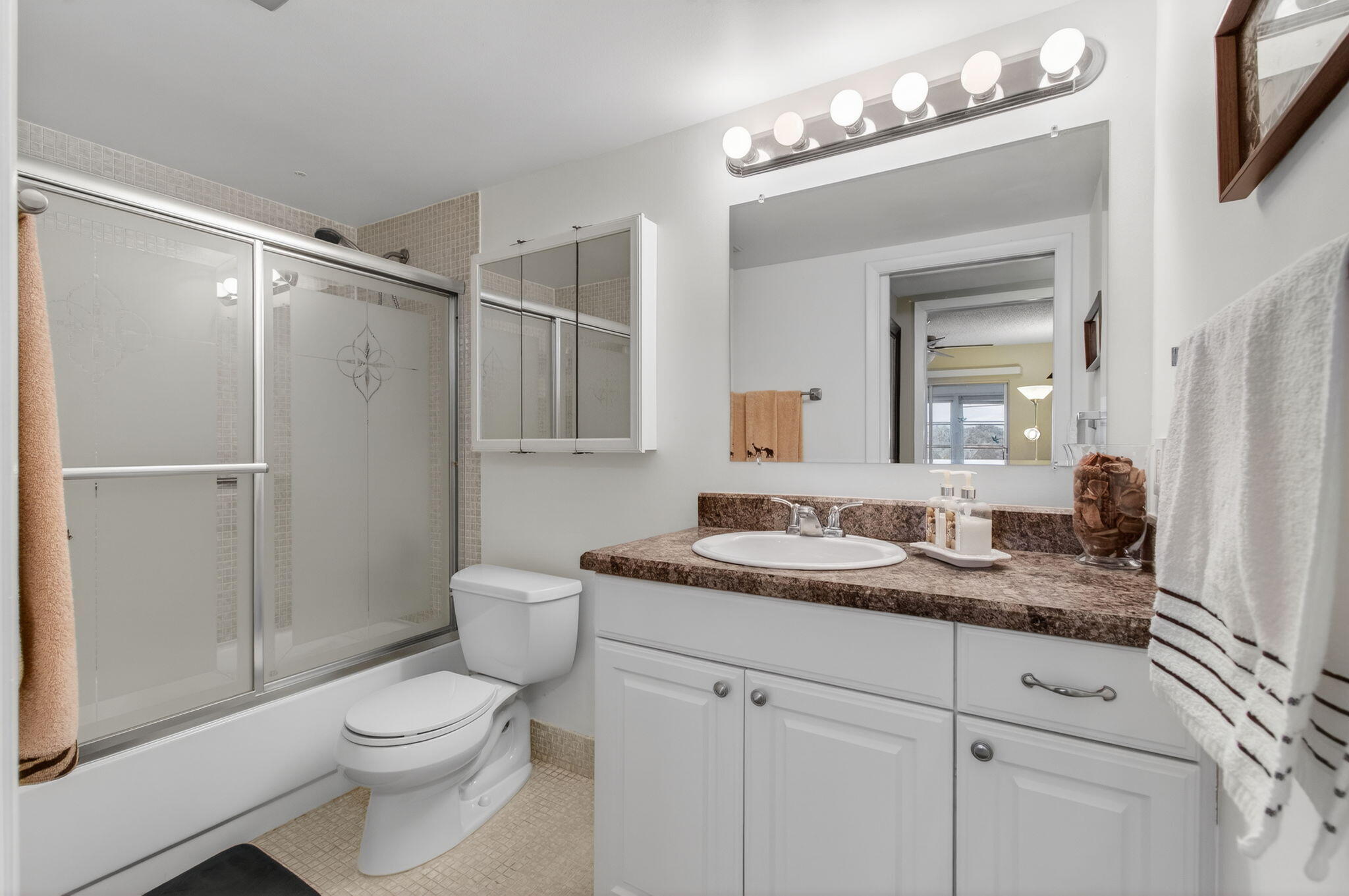 4082 Wolverton East Boca Raton, FL 33434 - Photo 28 of 93 a bathroom with a granite countertop sink toilet a mirror a vanity and shower