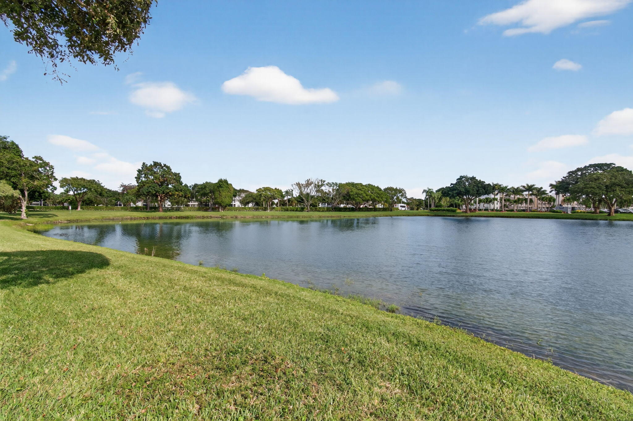 4082 Wolverton East Boca Raton, FL 33434 - Photo 44 of 93 a view of a lake with houses in the back