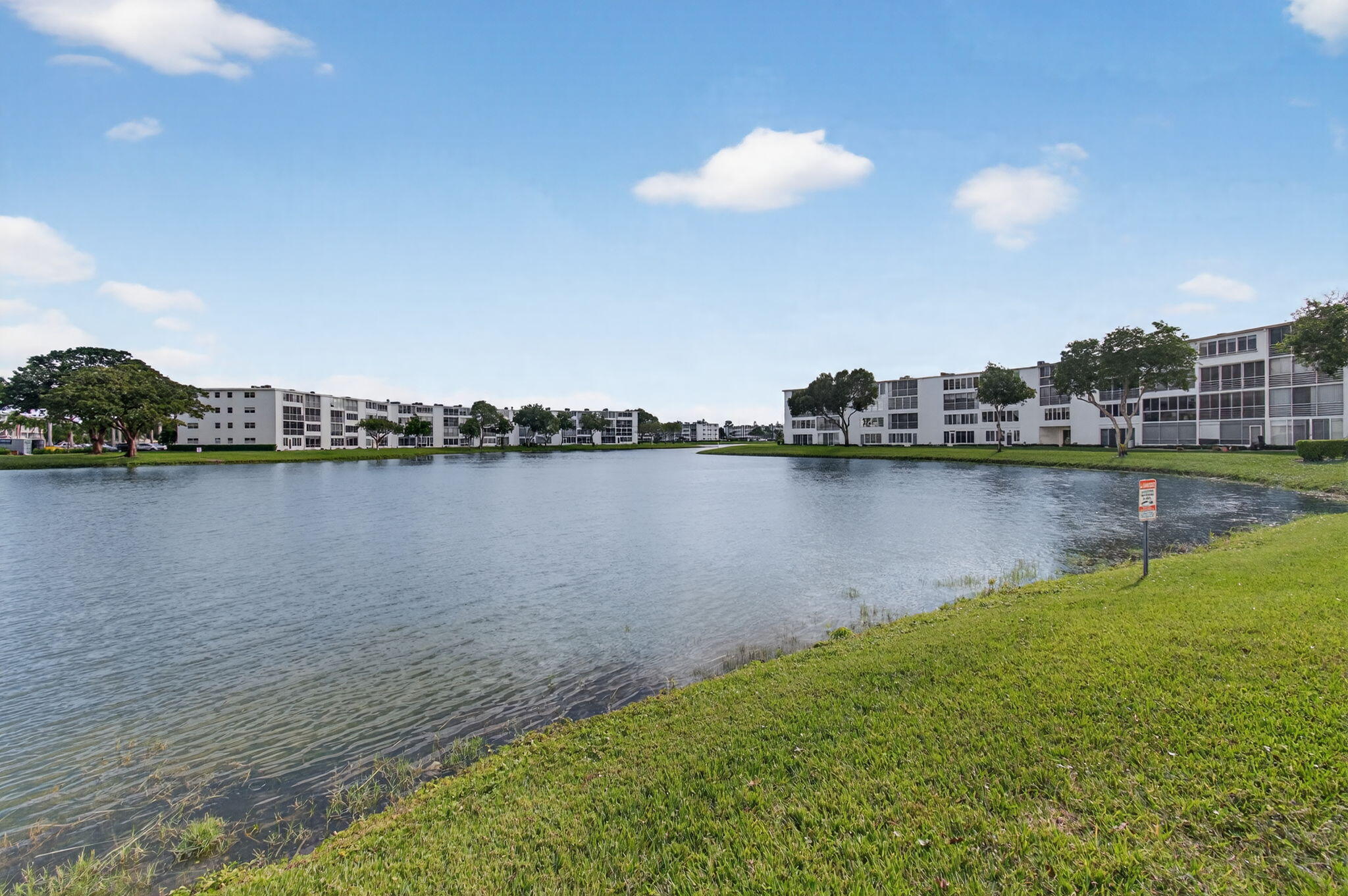 4082 Wolverton East Boca Raton, FL 33434 - Photo 45 of 93 a view of a lake with houses in the back