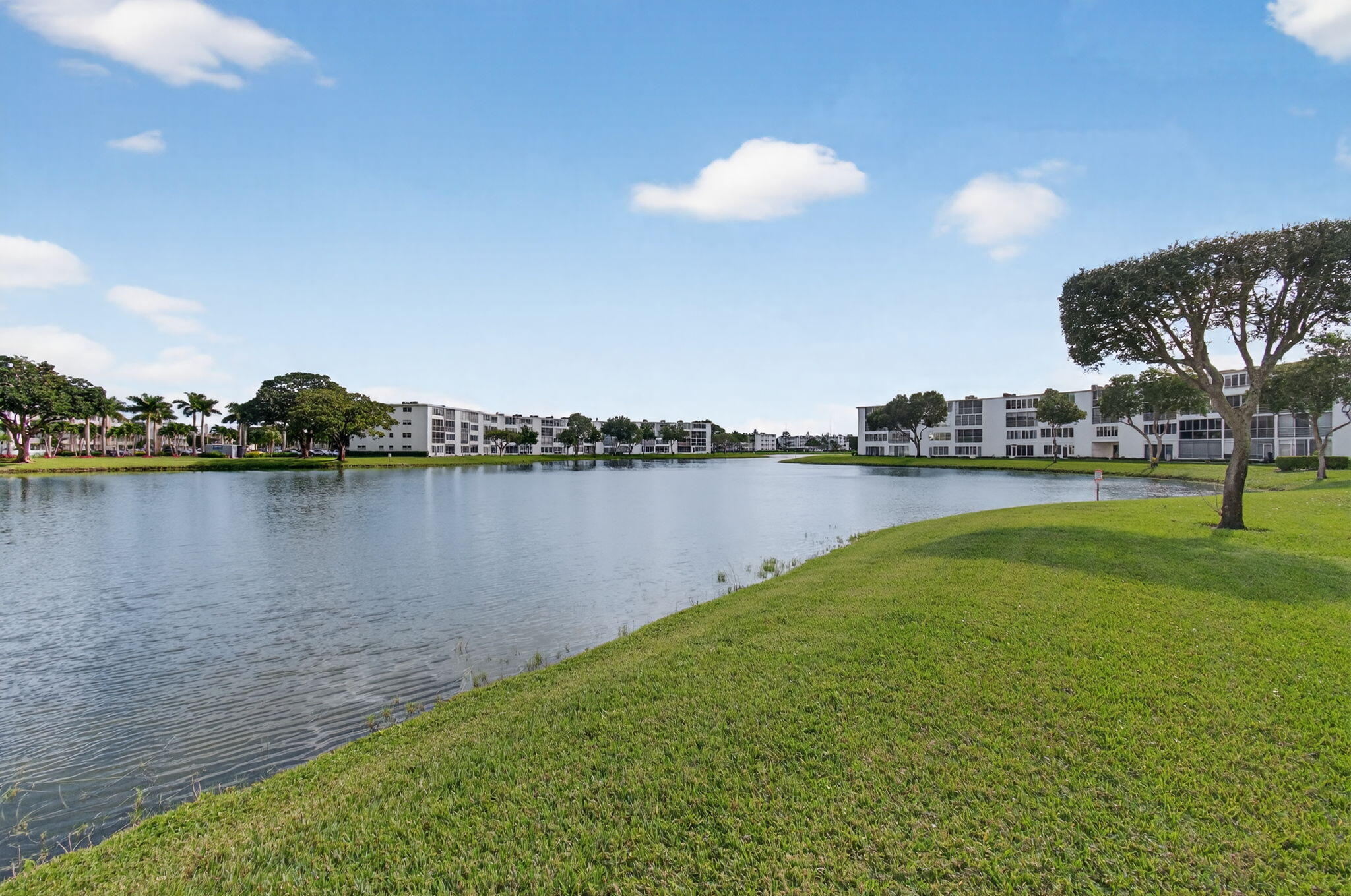 4082 Wolverton East Boca Raton, FL 33434 - Photo 49 of 93 a view of a lake with houses in the back