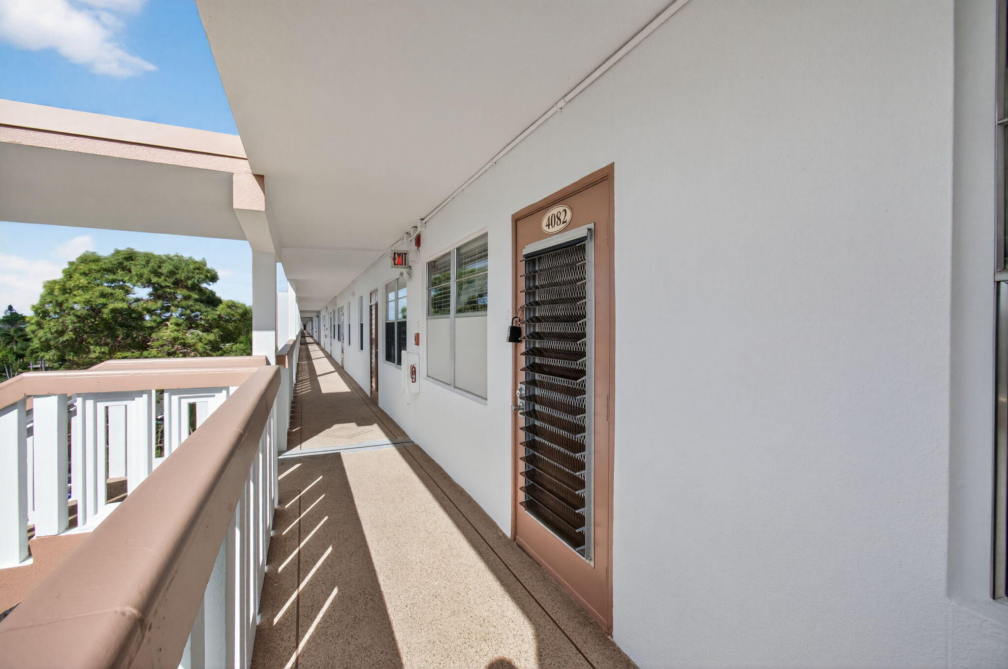 4082 Wolverton East Boca Raton, FL 33434 - Photo 54 of 93 a view of a hallway with wooden floor and staircase
