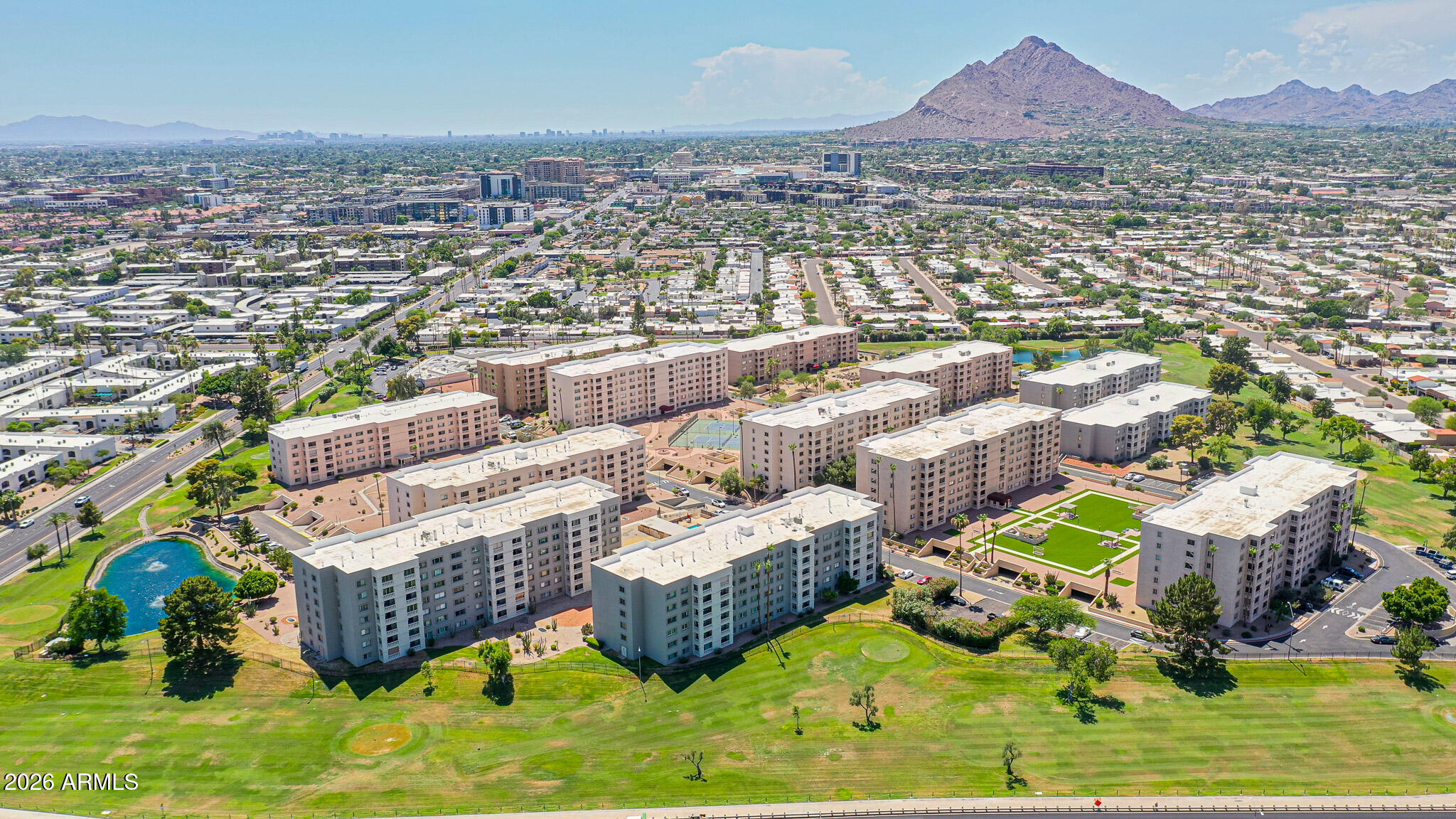 7920 East Camelback Road, Unit 111 Scottsdale, AZ 85251 - Photo 32 of 32 an aerial view of a house with a swimming pool