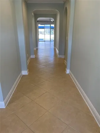 wooden floor in a hallway with a window