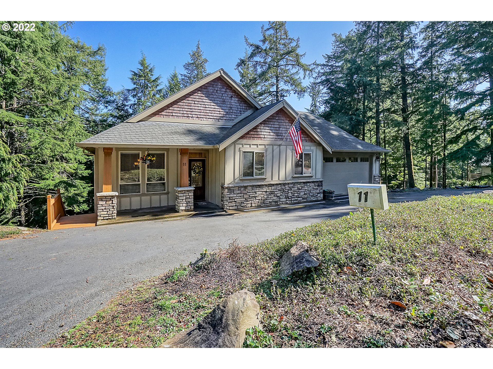 11 Big Tree Road Gleneden Beach, OR 97388 - Photo 1 of 32 a front view of a house with garden