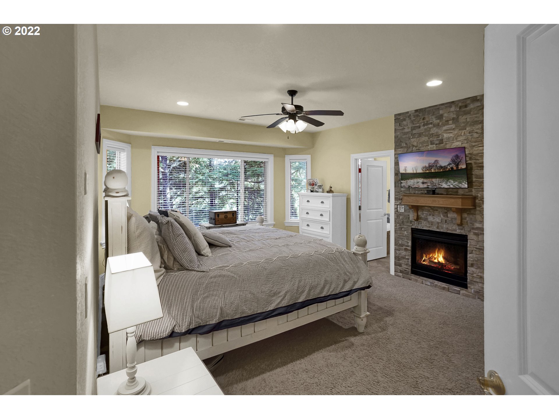 11 Big Tree Road Gleneden Beach, OR 97388 - Photo 15 of 32 a living room with furniture a fireplace and a flat screen tv