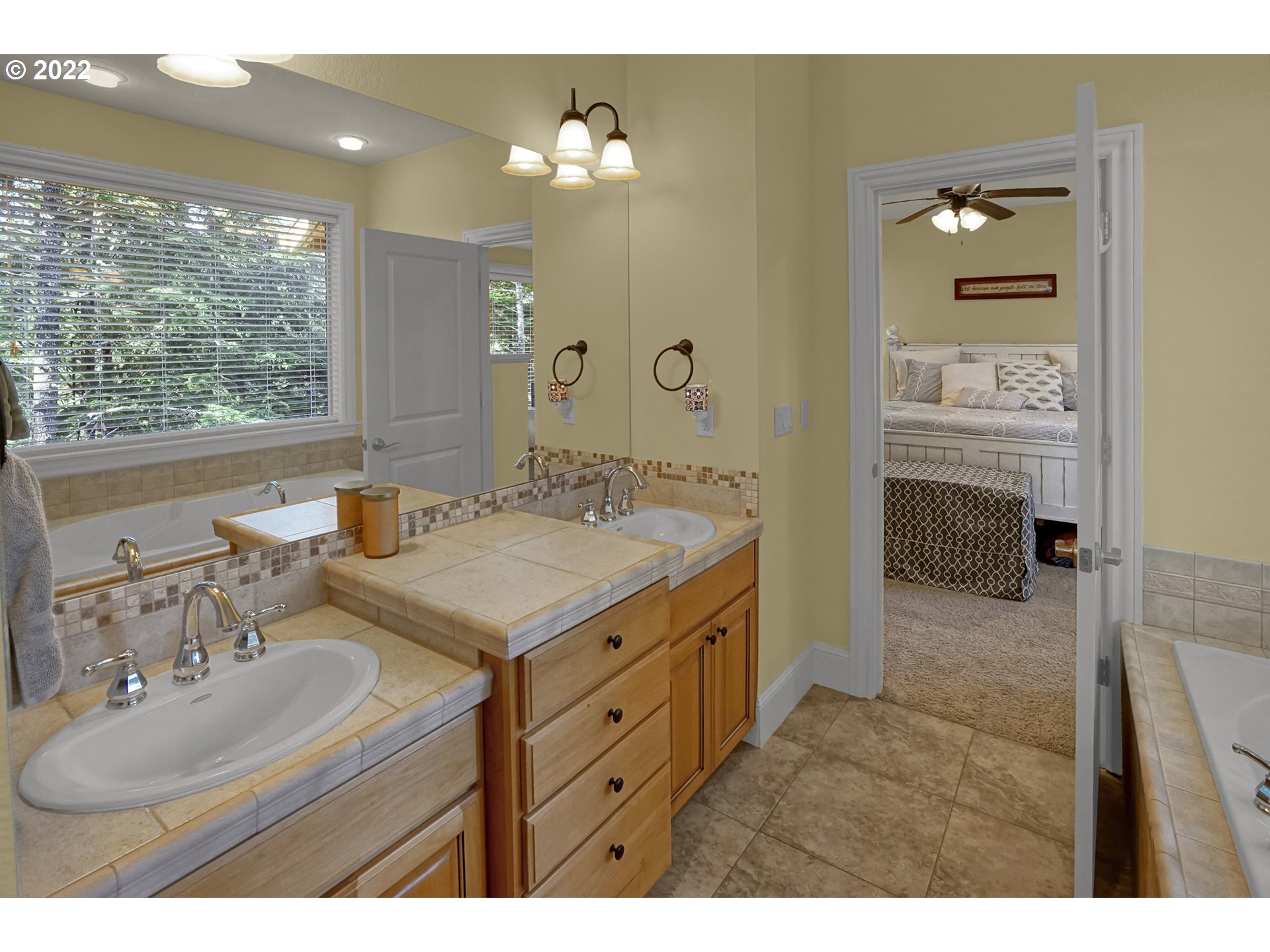 11 Big Tree Road Gleneden Beach, OR 97388 - Photo 18 of 32 a en suite bathroom with a sink double vanity and a mirror