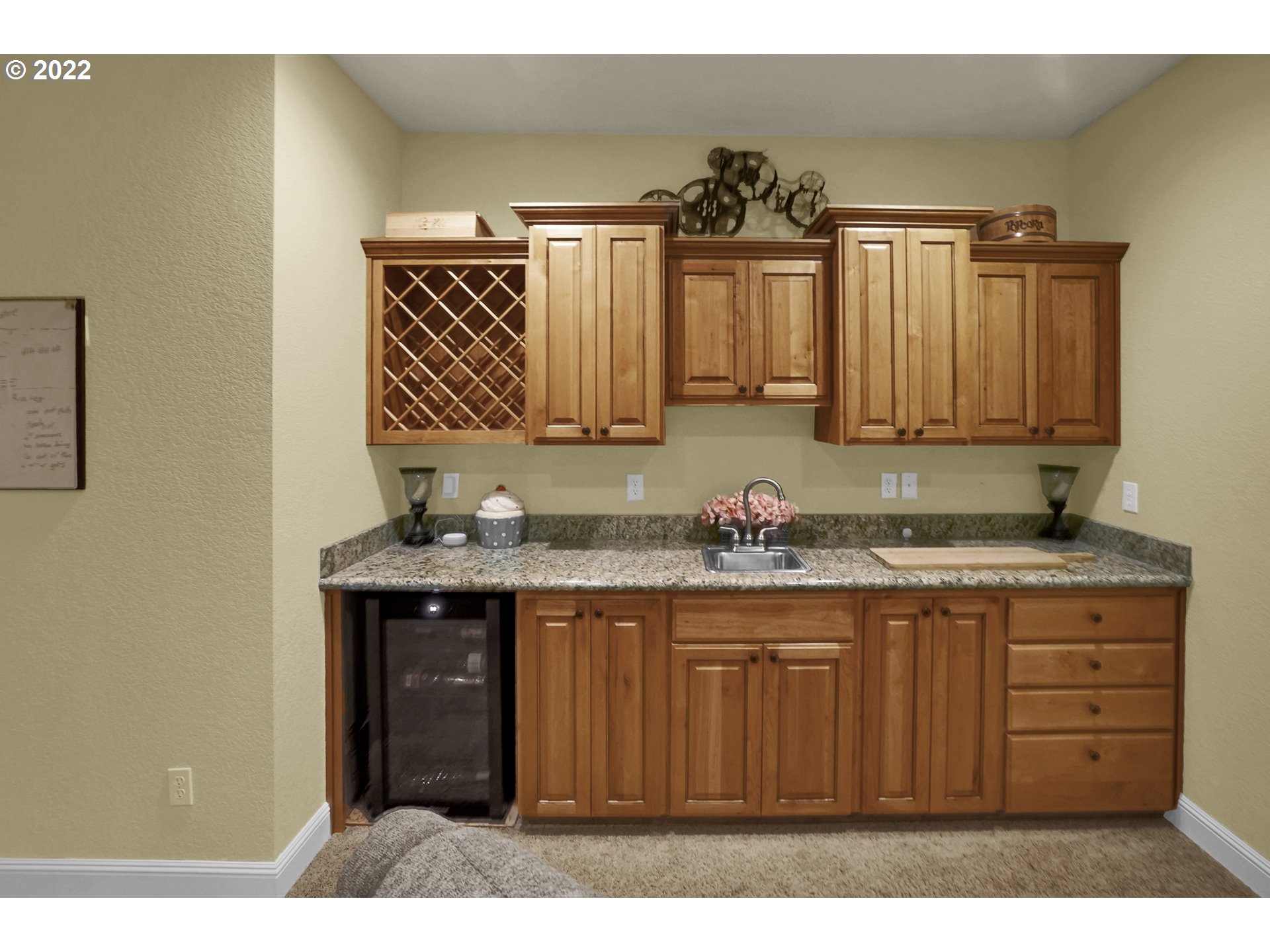 11 Big Tree Road Gleneden Beach, OR 97388 - Photo 20 of 32 a kitchen with granite countertop a sink and cabinets