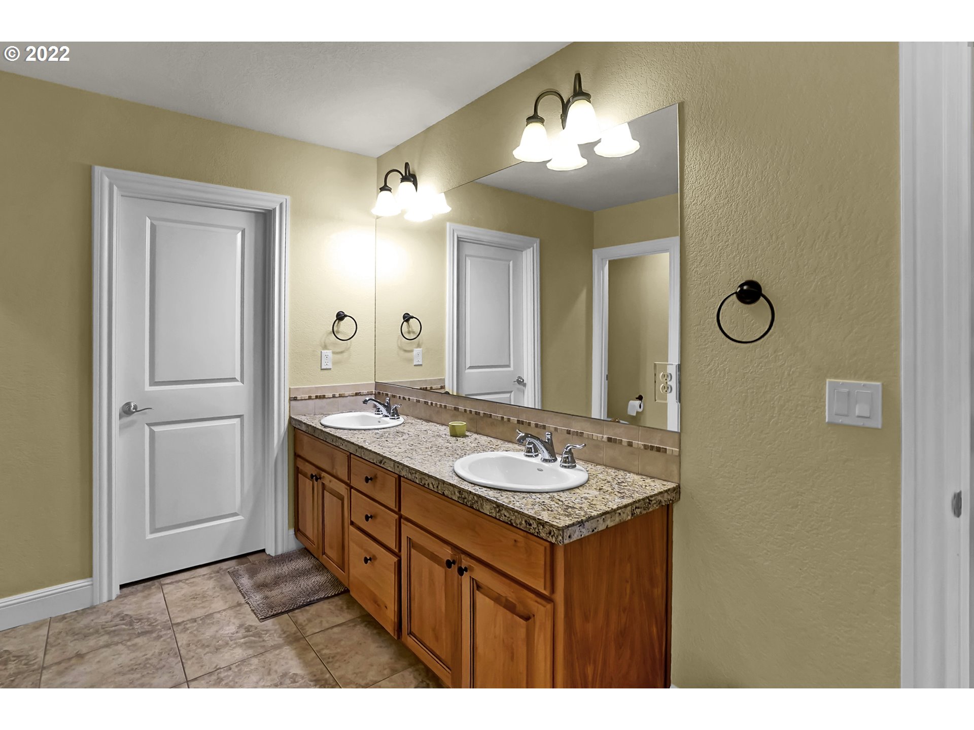 11 Big Tree Road Gleneden Beach, OR 97388 - Photo 23 of 32 a bathroom with a sink a light fixture and a mirror
