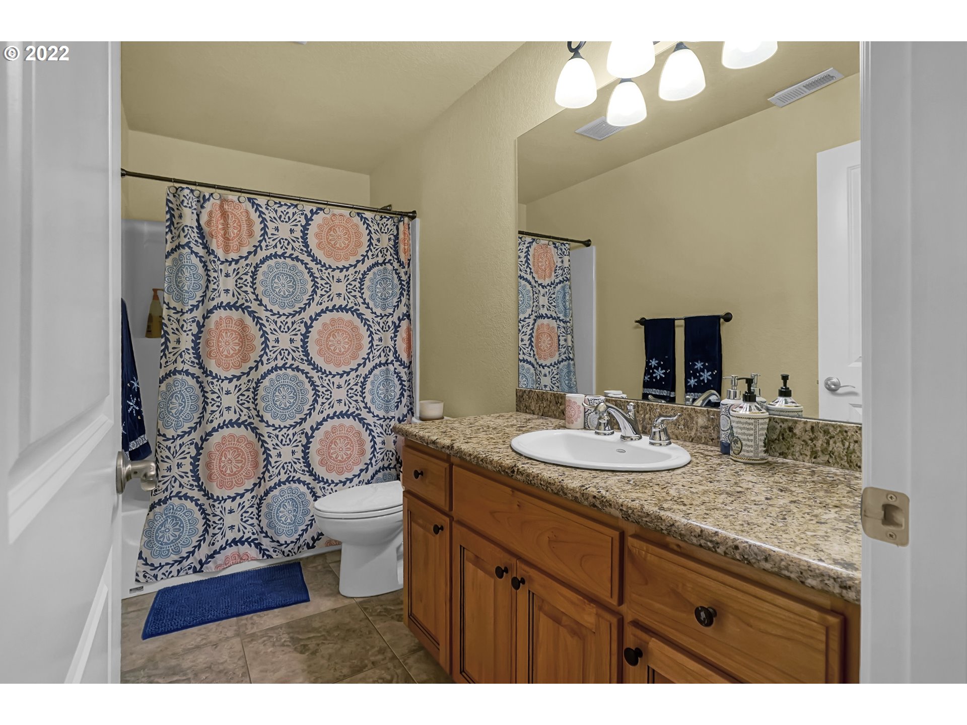 11 Big Tree Road Gleneden Beach, OR 97388 - Photo 29 of 32 a bathroom with a granite countertop sink and a mirror