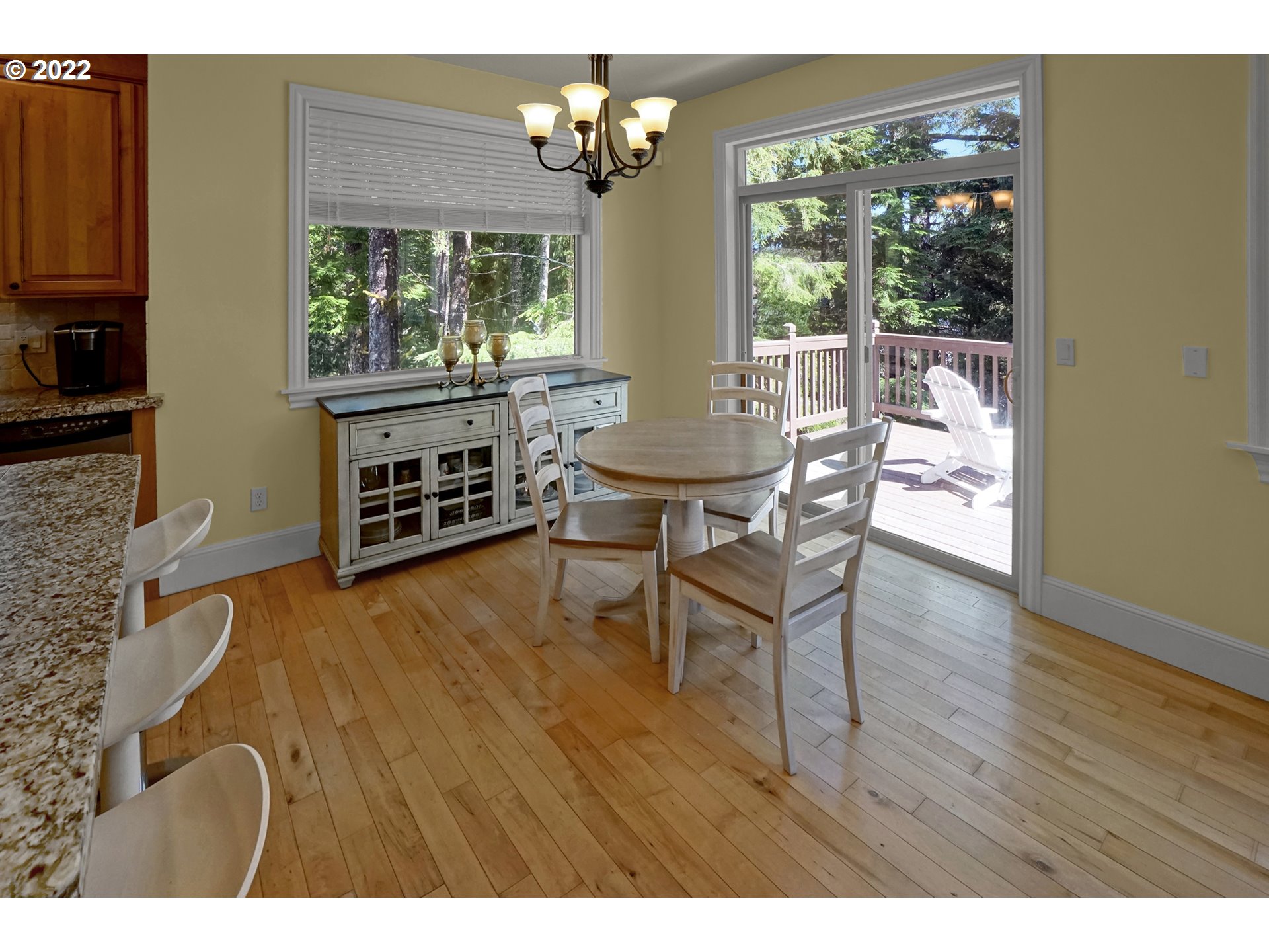 11 Big Tree Road Gleneden Beach, OR 97388 - Photo 9 of 32 a view of a dining room with furniture a chandelier and wooden floor