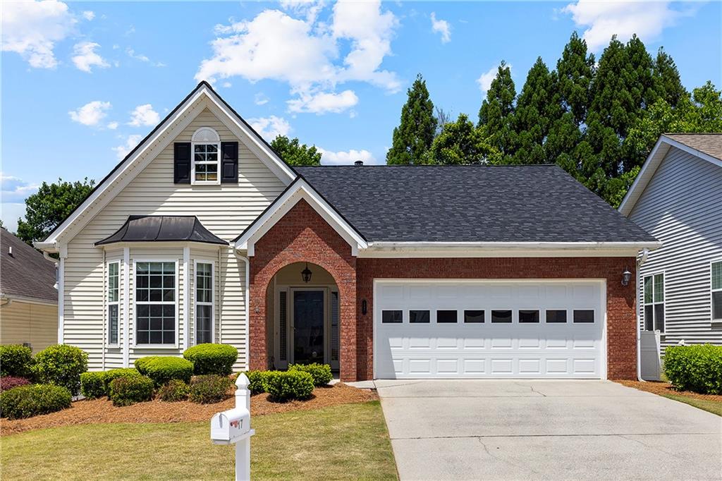 17 Williams Pride Way Newnan, GA 30265 - Photo 1 of 28 a front view of a house with garden