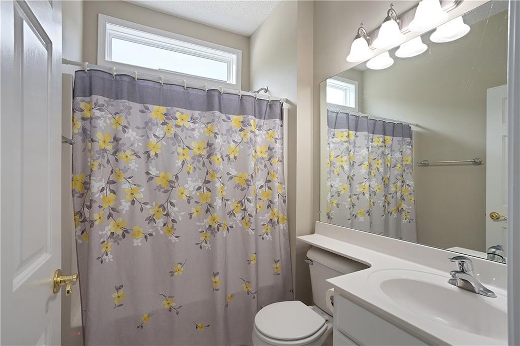 17 Williams Pride Way Newnan, GA 30265 - Photo 18 of 28 a bathroom with a sink toilet mirror and shower