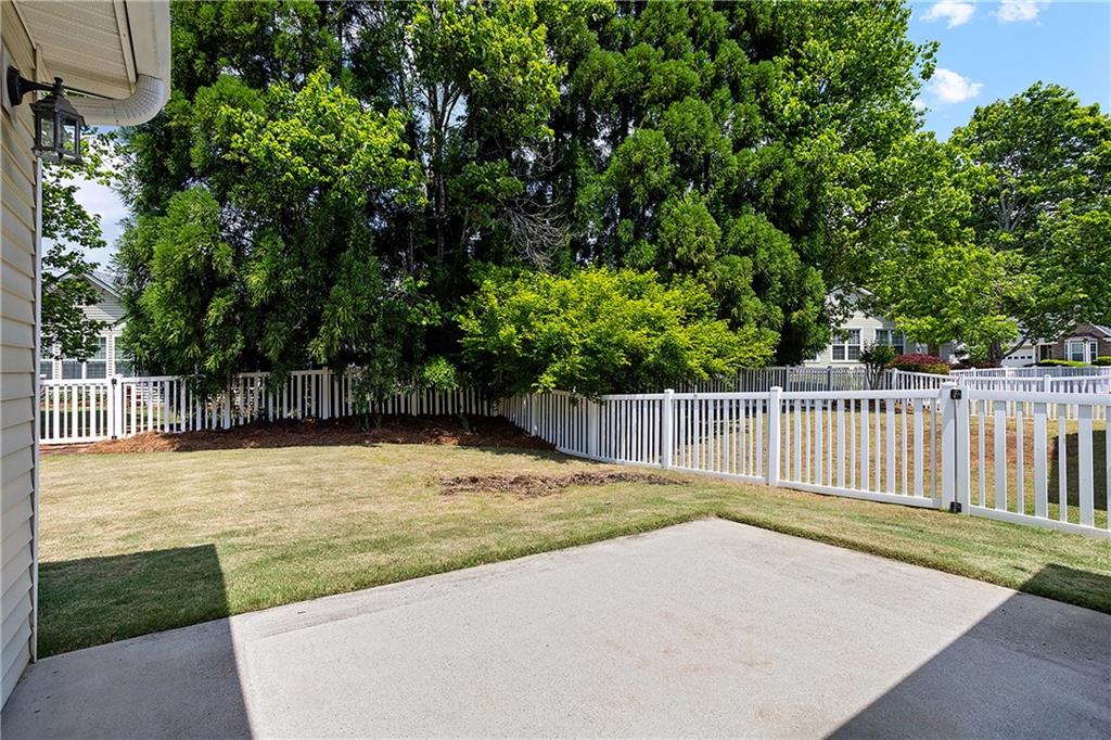 17 Williams Pride Way Newnan, GA 30265 - Photo 22 of 28 a swimming pool with wooden fence
