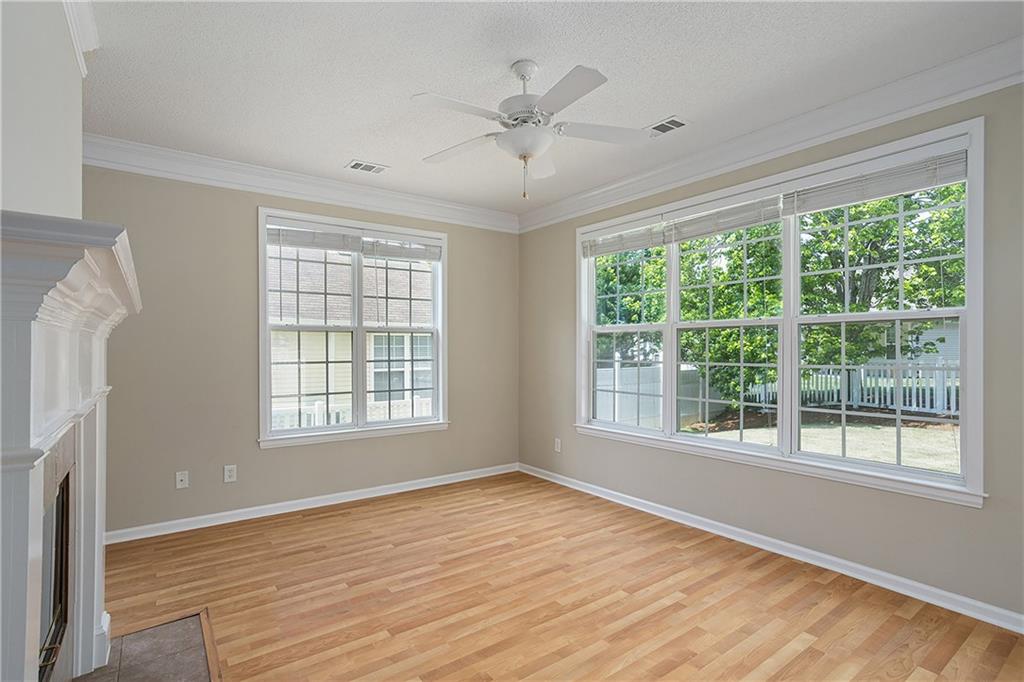 17 Williams Pride Way Newnan, GA 30265 - Photo 10 of 28 a view of an empty room with a window and wooden floor