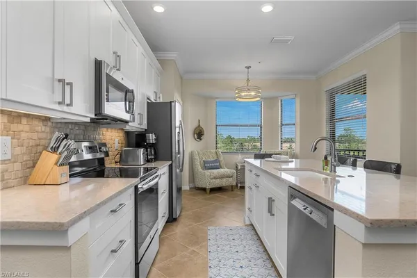 a kitchen with a sink stove and refrigerator